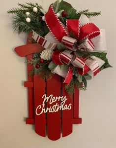 a red sled decorated with christmas decorations