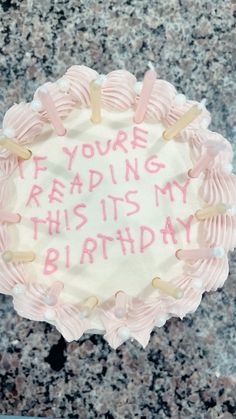 a birthday cake with writing on it that says you're reading this is my birthday