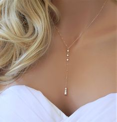 "Wedding Lariat Necklace Simple and elegant lariat necklace which features three small CZs and one CZ pendant. IT'S IN THE DETAILS ✦ Necklace is shown at 17\" with a 3\" drop in Rose Gold ✦ Rose Gold Filled, 14K Gold Filled or Sterling Silver Chain, Clasp and Rings ✦ (3) Rose Gold, Gold or Silver Plated CZ Connectors ✦ Bottom Rose Gold, Gold or Silver Plated Rectangle CZ Charm WHY YOU'LL LOVE IT * Because handmade = made with love, care, and thought. * Ethically Sourced * Comes beautifully gift Gold Necklace Wedding, Wedding Necklaces, Detailed Necklace, Necklace Bridal, Gold Jewelry Necklace, Bridal Gold Jewellery, Diamond Pendant Necklace, Lariat Necklace, Simple Jewelry