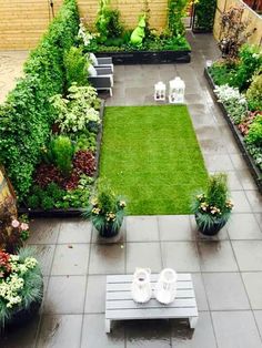 an outdoor garden with lawn and seating area