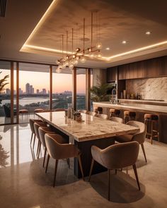 a large kitchen with marble counter tops and wooden chairs in front of an open floor plan