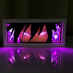 a purple light is shining in the dark with an image of anime characters on it