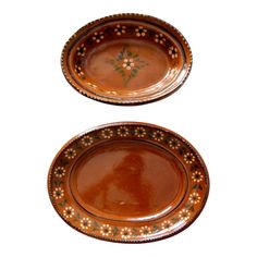 two brown plates sitting on top of each other