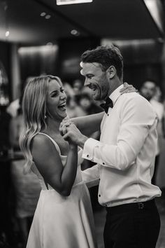 a man and woman dancing together at a wedding