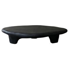 an image of a black foot stool on white background