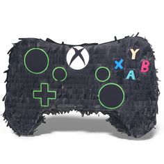 a video game controller made out of toilet paper with letters and symbols on the side