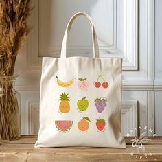 a white bag with fruit designs on it