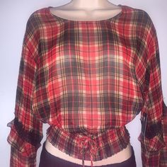 Guess Long Sleeve Sheer Plaid Blouse With A Hint Of Metallic Shine Long Sleeve With Ruffled Overlay And Lace Detail Complete With A Smocked Lace Up Hem/ Waist Crew Neck Size : Small 99% Polyester, 1% Metallic Fabric Type : Chiffon Casual Plaid Blouse With Ruffles, Chic Plaid Blouse For Daywear, Plaid Blouse For Fall Day Out, Plaid Blouse For Day Out In Fall, Plaid Long Sleeve Blouse For Day Out, Fitted Casual Plaid Blouse, Red Fall Blouse For Daywear, Red Fall Blouse, Red Blouse For Fall