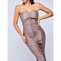 This mocha colored midi dress is just as sexy as she needs to be. Featuring: Sweetheart strapless with molded cups in bust Silicone tape in bodice to hold up the top Super stretchy and fitted 95% Polyester, 5% Spandex Ruching throughout for a flattering fit Invisible Back Zip closure Midi length Fully lined Model is 5'9" Bust 33"| Waist 25"| Hips 36", and is wearing a size S. Flare Maxi Skirt, Silicone Tape, Ribbed Maxi Dress, Mocha Color, How To Look Rich, Strapless Midi Dress, Ribbed Midi Dress, Los Angeles Style, Wholesale Fashion