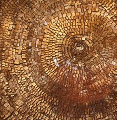 a close up view of a circular design made out of small bricks and wood blocks