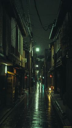 an empty street at night in the rain