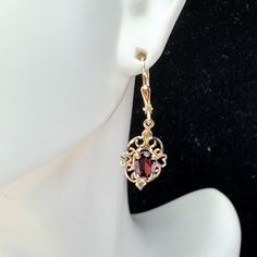 A Pair Of Mid-Century Orante 9 Yellow Gold Lady Earrings. Featuring An Oval Cut Natural Bohemia Garnet, 6.8 X 3.7mm, Prong Setting On A Filigree Scroll Etching Frame. Lever Back Earring Back. Hanging Length 1 1/4" X 11mm, Weight 2.0gm, Hallmark 375 Earring Backs, Oval Cut, Prong Setting, Etching, Hallmark, Garnet, Women's Earrings, Dangle Earrings, Jewelry Earrings