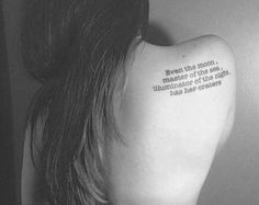 the back of a woman's neck with a quote on it that reads, even the