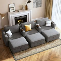 a living room filled with furniture and a fire place in the corner on top of a hard wood floor