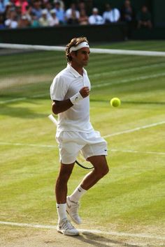 a male tennis player in action on the court