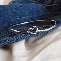 "Heart Frame Bangle, Layered bracelet for women, Sterling silver heart bangle, Hammered, Complete any outfit you wear. Handmade Simple and trendy love gift bangle. Made by using silver 2mm wires. Very important! to avoid mistakes, please make sure you have the right size. If you not sure then look at item photos and learn how to do it. x-small - 2.25\" diameter 7.5\"circumference small - 2.5\" diameter 8\"circumference (standard, most common) medium - 2.75\" diameter 8.5\"circumference Large - 3 Valentine's Day Wedding Sterling Silver Bracelet, Wedding Bangle Bracelet With Heart Charm, Adjustable Heart Bangle Bracelet For Wedding, Handmade Heart Bracelet For Anniversary, Valentine's Day Dainty Bangle Bracelets, Anniversary Bangle Bracelet With Heart Charm, Heart Charm Bangle Bracelet For Wedding, Silver Open Heart Bracelet For Wedding, Silver Bangle For Anniversary On Valentine's Day