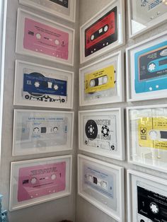 there are many cassette tapes on the wall