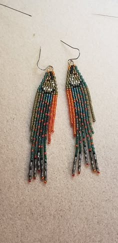 Sparkly beaded Dolly Varden fish earrings. Fun and beautiful. Orders must be in by December 15th in order to make it by Christmas to most states in the US. Beaded Earrings Fun, Seed Bead Fish Pattern, Trout Beaded Earrings, Dangle Bead Earrings Diy, Beaded Fish Earrings, Fringe Beaded Earrings Pattern, Beaded Fish Pattern, Native Earrings Beaded, Dolly Varden