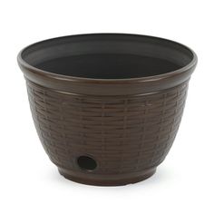 a brown basket style planter on a white background