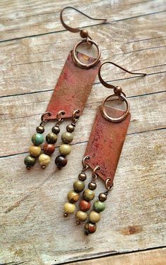 the earrings are made out of metal and beads