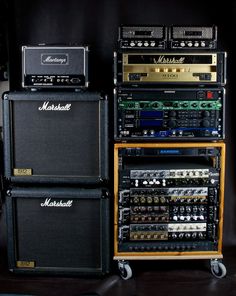 three amps are stacked on top of each other