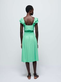 The tiered ruffle straps and smocked waistline make this the must-have midi dress of the season. Go ahead. Show off a little. (This one comes in Katydid.) | Women's Brittini Midi Dress in Katydid | Ethical Essentials Green Summer Midi Dress With Gathered Neckline, Green Midi Dress With Gathered Neckline For Summer, Ruched Smocked Dress With Ruffled Straps For Daywear, Daywear Smocked Dress With Ruched Ruffled Straps, Ruched Tiered Skirt Midi Dress For Daywear, Green Sleeveless Dress With Elastic Waistband, Green Spring Midi Dress With Ruffled Straps, Green Midi Dress With Ruffled Straps For Spring, Green Midi Dress With Ruffled Straps