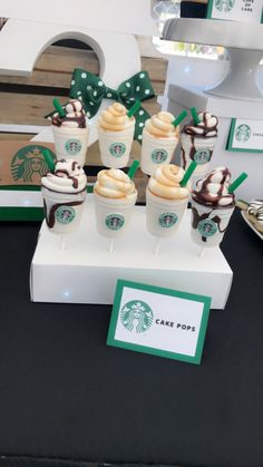 starbucks cupcakes are arranged on a table