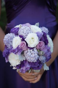 a purple and white wedding bouquet on instagram