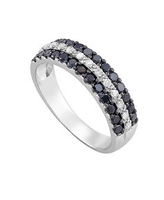 a white gold ring with black and white diamonds