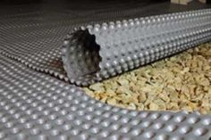 a close up of a metal surface with granola on it's bottom and an object in the middle