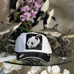 Introducing The Goorin Bros Farm Animal Trucker Big In China Giant Panda Hat Friday Drop! This Limited Edition Hat Is Perfect For Any Occasion, Whether It's For Travel, Parties, Cocktails, Or Just A Casual Day Out. The Adjustable Size Makes It Versatile For Anyone, And The Breathable Fabric Type Of Canvas Ensures Comfort In Any Season, Be It Winter, Summer, Fall, Or Spring. The Solid Pattern, Multicolor, And Animal Theme Add A Fun Touch To Any Outfit, Without Compromising On Style. Made With Hig Novelty Trucker Hat One Size Fits Most, Designer White Hat With Curved Brim, Luxury White Snapback Hat, Luxury White Adjustable Hat, Designer White Snapback Hat, Novelty Trucker Hat With Flat Brim, Designer White Visor Baseball Cap, Designer White Visor Hat, Luxury White Visor Hat