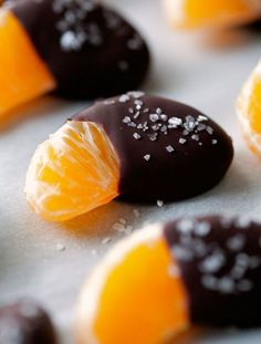 chocolate covered oranges and candies on a baking sheet