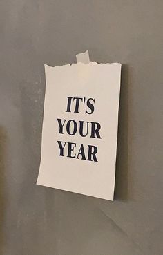 a piece of paper with the words it's your year written on it next to a toilet