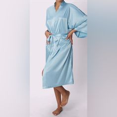 Bring The Hotel Home With This Beautiful Sustainable Satin Robe. Now Made In Full Length So That You Can Feel Luxe From Head-To-Toe! Loose Comfortable Full Length Fit. Features:Parade Logo Charm At Back Luxe Satin Belt Closure Wide Cut Sleeves. Fabric: Luxe Satin Is 92% Recycled Polyester And 8% Elastane.Care Instruction: Machine Wash Cold. Tumble Dry Low Or Dry Clean. Do Not Bleach. Cool Iron If Needed. Elegant Blue Sleepwear For Lounging, Elegant Blue Sleepwear For Relaxation, Blue Spring Robe For Lounging, Blue Summer Robe For Relaxation, Blue Sleepwear For Wedding Night In Spring, Blue Summer Robe For Daywear, Blue Robe For Summer Daywear, Blue Summer Sleepwear For Wedding Night, Pink Silk Robe