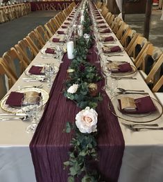 the long table is set with place settings