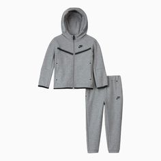 The Nike Sportswear Tech Fleece Set is made with soft, lightweight fleece fabric to help keep little ones warm when temperatures drop. Benefits Nike Tech Fleece fabric offers the ultimate in lightweight warmth. Binding along the cuffs and hem creates a clean, stay-put look. Product Details Full-length zipper Front pockets on hoodie and pants 67% cotton/33% polyester Machine Wash Color: Dark Grey Heather Style: 86H052-042