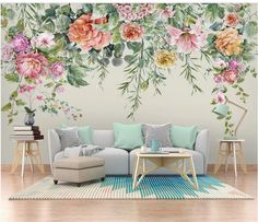 a living room with flowers painted on the wall