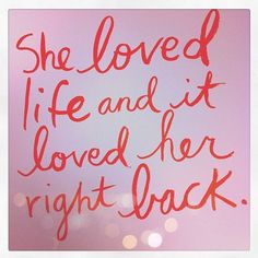 a pink background with the words she loved life and it loved her right back