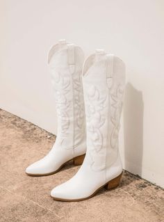 Urson Boot White by Billini Cowboy boots Western style stitching Stacked cuban heel Twin pull tabs Arched cuff Pull on design Man made upper, lining & sole Heel height: 6cm / 2.36” Hero image: @deanaduka White Cowgirl Boots, Tan Leather Boots, Luxury Boots, Camila Morrone, Last Ride, Cuban Heels, Tan Boots, White Boots