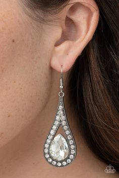 An oversized white teardrop gem is nestled inside the bottom of a ribbon of glittery white rhinestones, creating a dramatic lure. Earring attaches to a standard fishhook fitting.

 Sold as one pair of earrings. Diamond Chandelier, Rhinestone Wedding, Fish Hook Earrings, Paparazzi Accessories, White Rhinestone, Affordable Jewelry, Paparazzi Jewelry, White Earrings, Metal Earrings