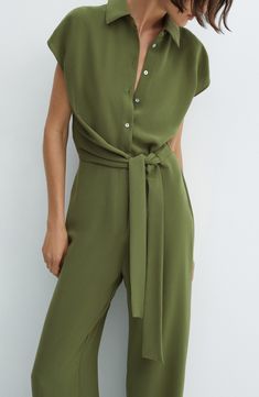 A drapey sash defines your figure in this fashion-forward jumpsuit made with flowy fabric and full-length wide legs. Front button closure Spread collar Short sleeves Attached waist tie 100% polyester Machine wash, line dry Imported Wide Leg Workwear Jumpsuits With Tie Waist, Belted Wide Leg Jumpsuits For Work, Belted Wide-leg Jumpsuit For Work, Workwear Wide Leg Belted Jumpsuits And Rompers, Wide-leg Belted Jumpsuit For Work, Wide Leg Belted Jumpsuits For Workwear, Green Tie Waist Jumpsuit For Work, Chic Wide Leg Jumpsuits And Rompers With Tie Waist, Chic Belted Green Jumpsuits And Rompers