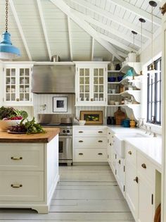 an instagram page with white cabinets and wood counter tops