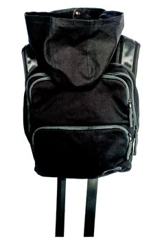 Blackout Backpack Tech Wear Essential with Hide A Way Hood As part of the ongoing resistance, we strive to bring light to the shadows and power to the people, so we are offering up an essential, all black backpack utilitarian masterpiece. Multifunctional, the Blackout Backpack hits you with the one, two, three combo of function, form, and fashion. Featuring an adjustable cowl neck with a secret hide a way hood inside, this piece also ranks high on comfort with foam lined shoulder straps and a fr Black Tactical Backpack For Outdoor, Black Tactical Outdoor Backpack, Tactical Black Outdoor Backpack, Practical Nylon Backpack For Streetwear, Multifunctional Nylon Backpack For Streetwear, Functional Black Anti-theft Backpack, Black Hiking Bags With Multiple Pockets, Modern Black Backpack With Functional Pockets, Black Techwear Backpack For Travel