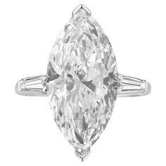 This breathtaking three-stone ring highlights a 4.26 carat marquise-cut diamond as its centerpiece, exuding elegance and brilliance. Crafted in platinum, the setting provides durability and a luxurious finish. Certified by GIA, the diamond is graded E in color, offering a near colorless and luminous appearance. A VS1 diamond with minor inclusions, which are hard to notice without magnification, ensuring high clarity and a dazzling shine. The Very Good polish enhances the diamond's surface, creat Flawless Diamond Ring, Oval Diamond Solitaire Ring, Marquise Solitaire Ring, Single Diamond Ring, Marquise Cut Diamond Ring, Oval Diamond Solitaire, Contemporary Engagement Rings, Marquise Diamond Ring, Flawless Diamond