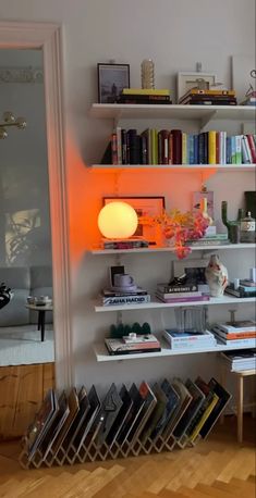 a bookshelf filled with lots of books next to a doorway