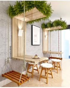 an empty room with wooden furniture and plants hanging from the ceiling, along with white stools