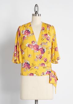 You are always ready for the next great opportunity to level-up in love, life, and in fashion when you wear this vintage-inspired yellow wrap top from our ModCloth namesake label ! Mixing vintage sourced rose motifs in pink and red hues taken from a 1960s scarf, accented with western rodeo icons like cowboy boots, cowboy hats, and horseshoes throughout, this in-house designed, quirky floral print is displayed throughout this top. Crafted from a lightweight, slightly textured weave this flowy top Top Spring Outfits, Boots Cowboy, Western Rodeo, Tie Neck Tops, Gingham Tops, Black And White Shirt, Top Shirt Women, Bridesmaid Outfit, Valentine's Day Outfit