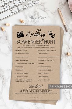 the wedding scavenger hunt is on top of a table next to a keyboard