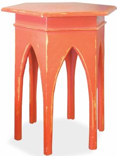 an orange side table with two legs and a small square shaped top on one end