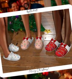 three pairs of children's shoes with bows on them, and christmas tree in the background